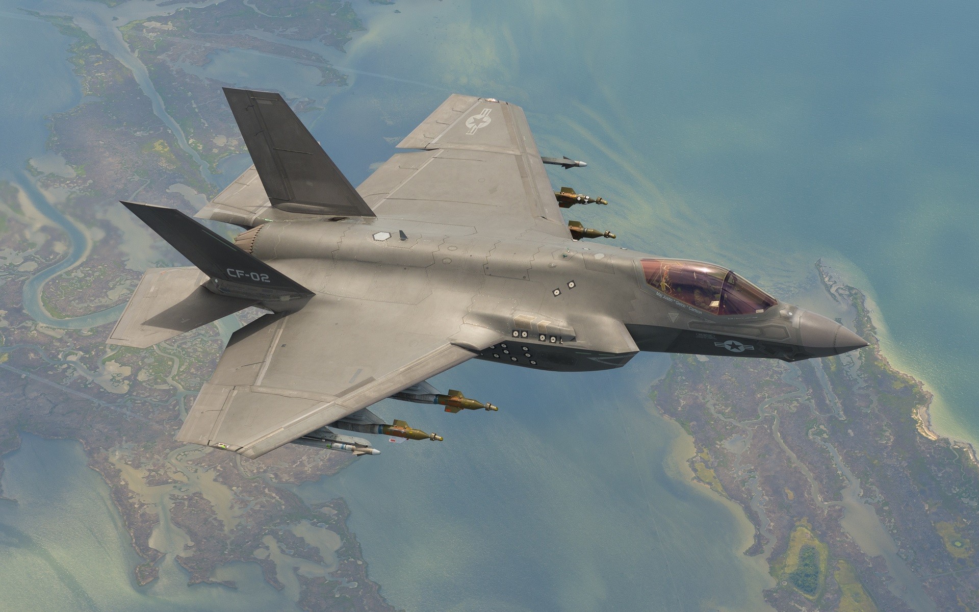 Lockheed Martin F-35 Lightning II flying over coastline HD Wallpaper