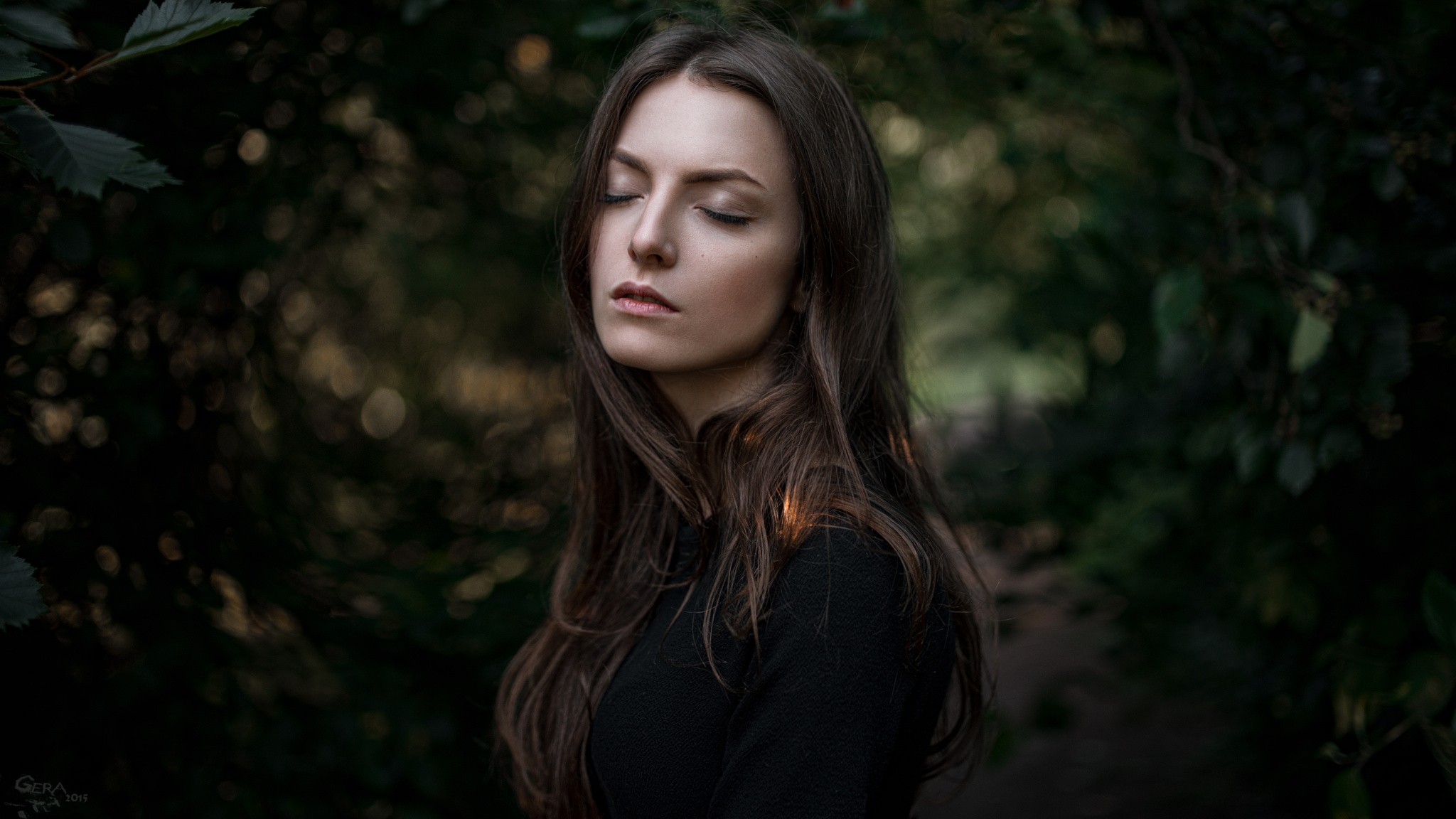 Woman with long brown hair and closed eyes outdoors HD Wallpaper