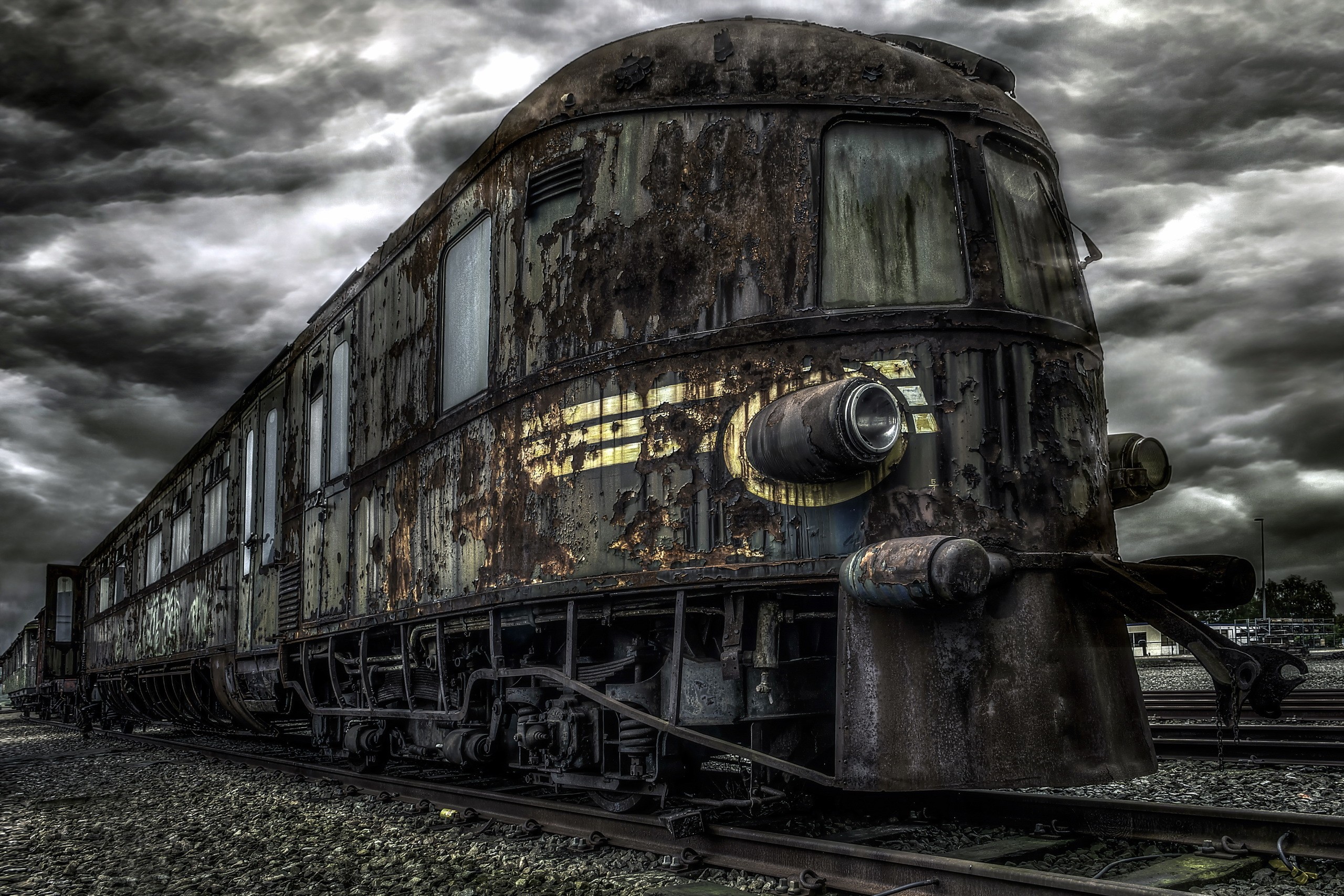 Abandoned rusty train under overcast sky HD Wallpaper