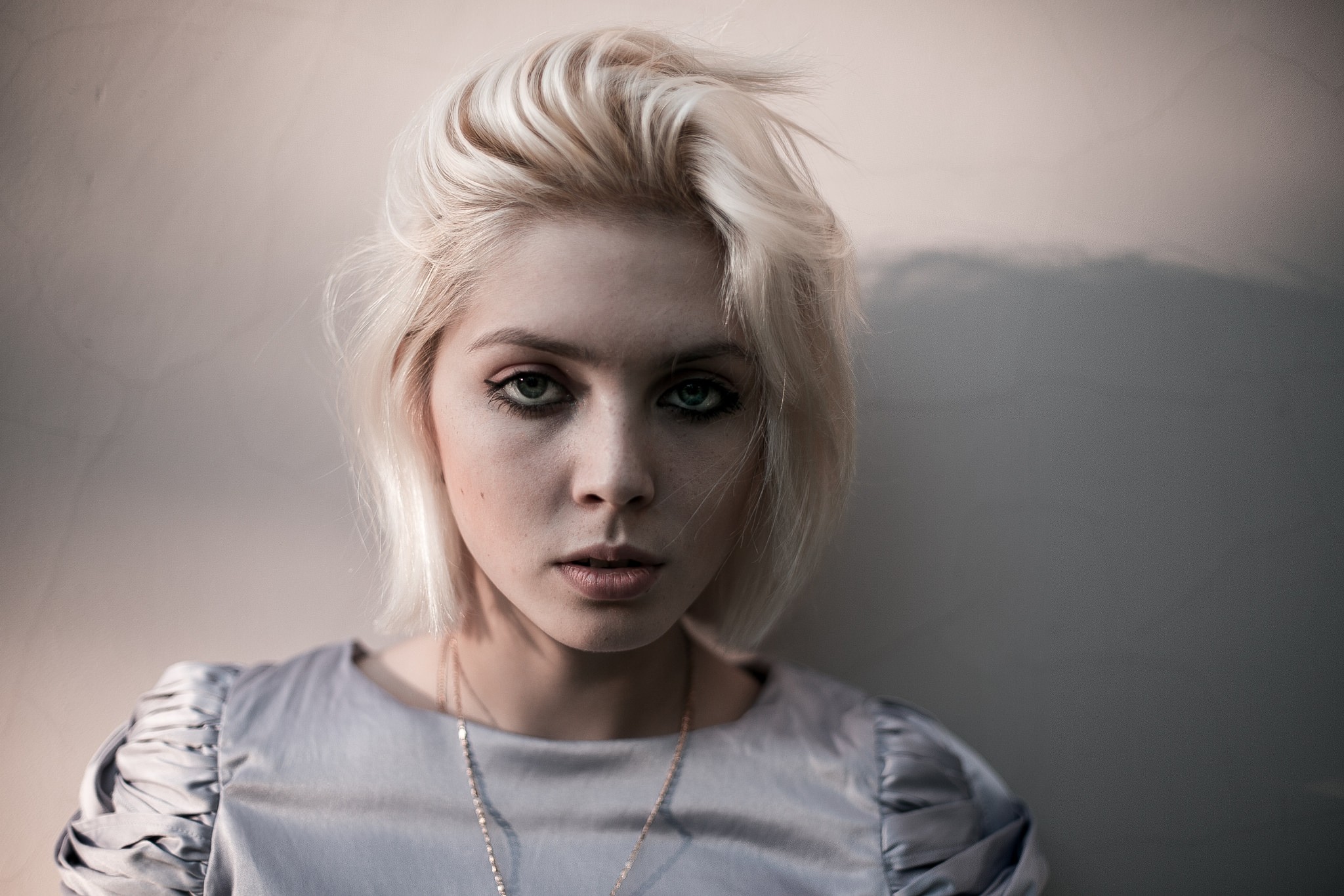 Portrait of a blonde woman with green eyes HD Wallpaper
