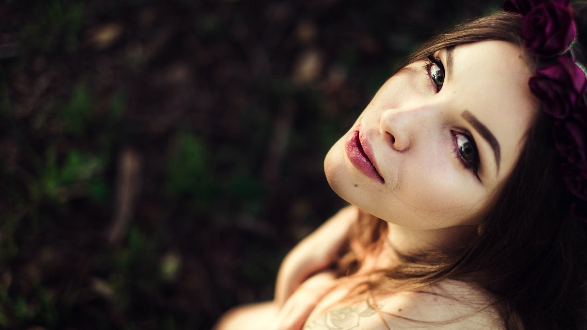 Brunette woman with flowers in her hair HD Wallpaper