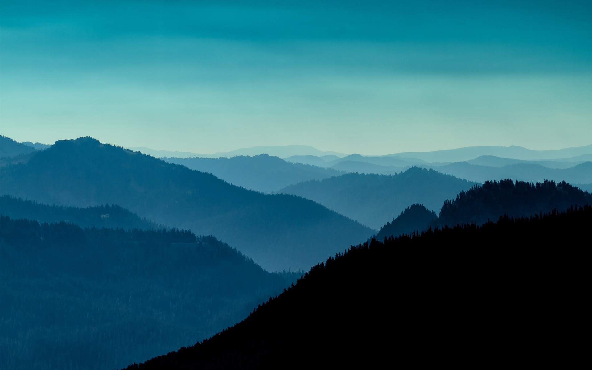 Blue mountain ranges fading into the horizon HD Wallpaper