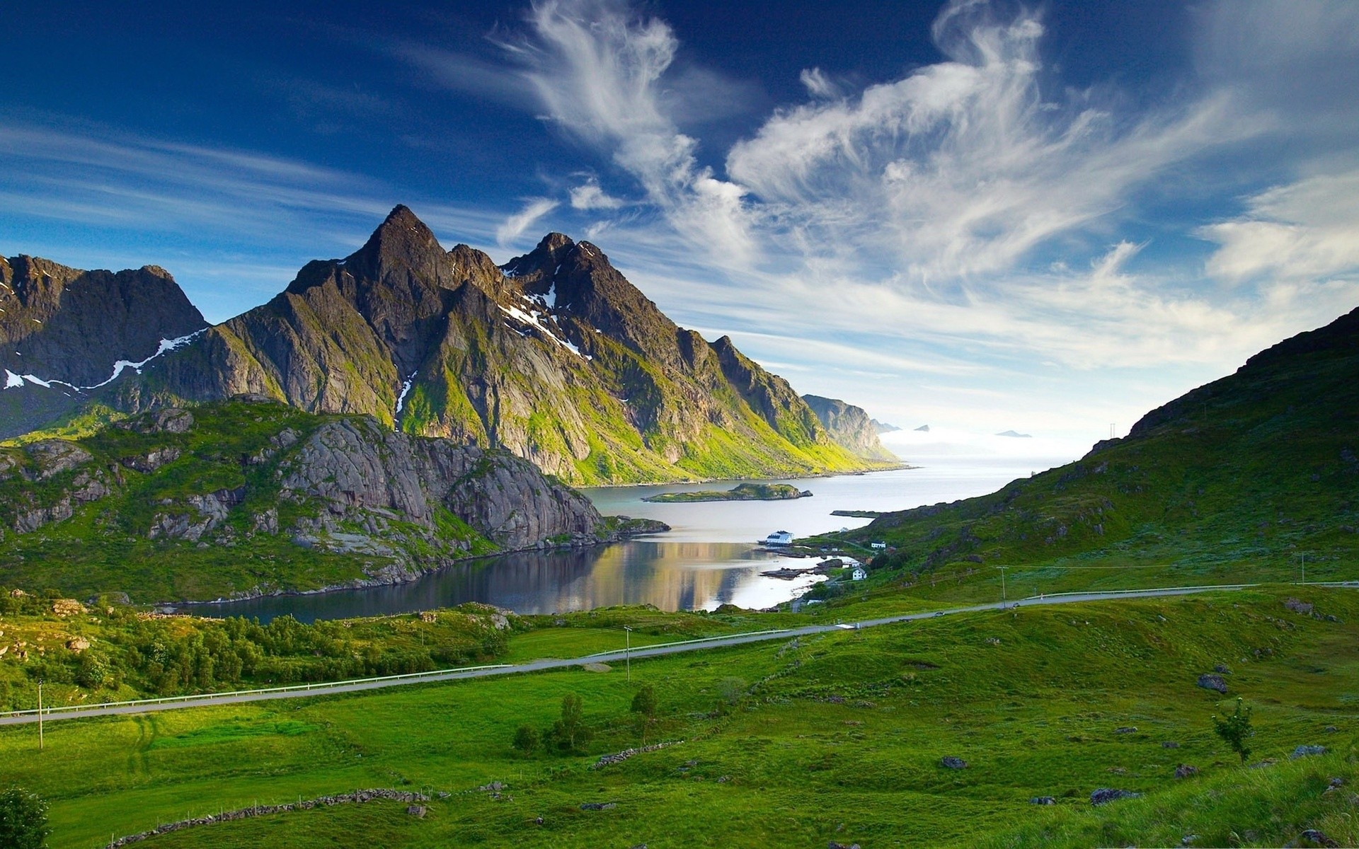 Green mountains and a lake under a blue sky HD Wallpaper