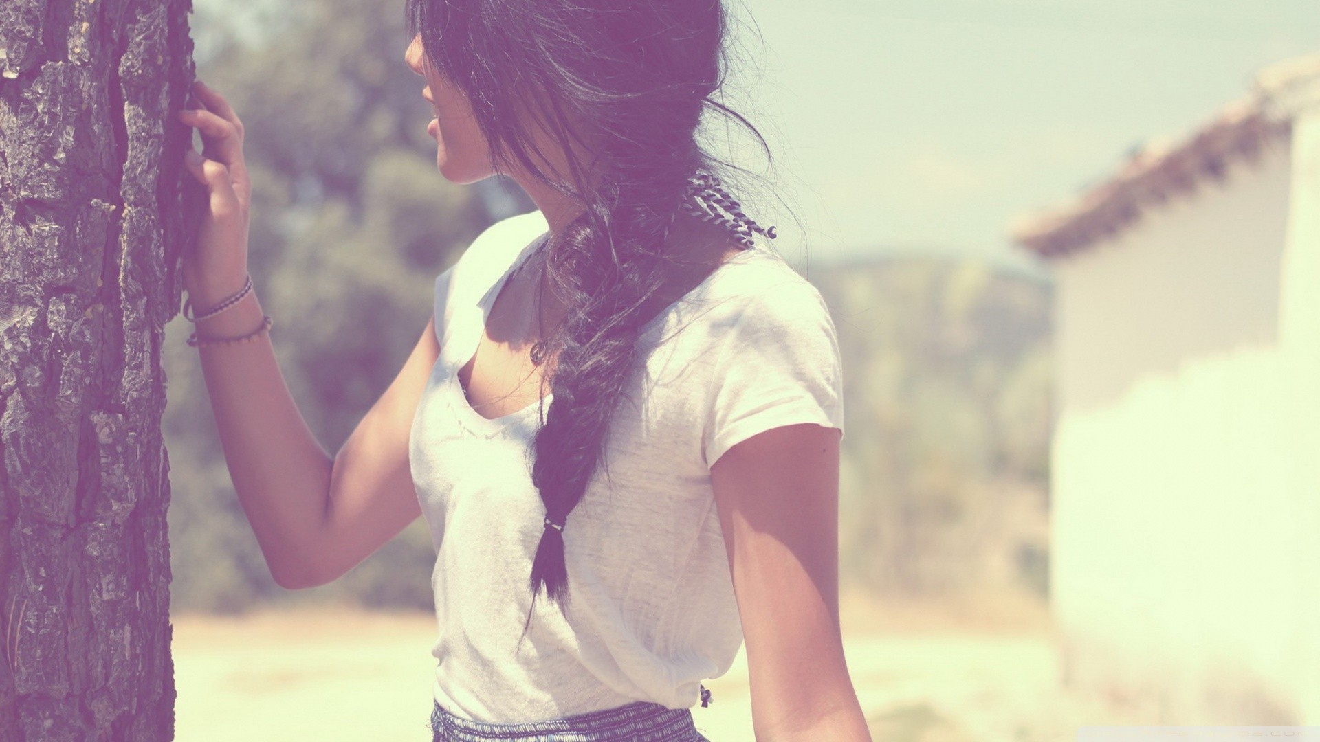 Woman with braid leaning on a tree HD Wallpaper