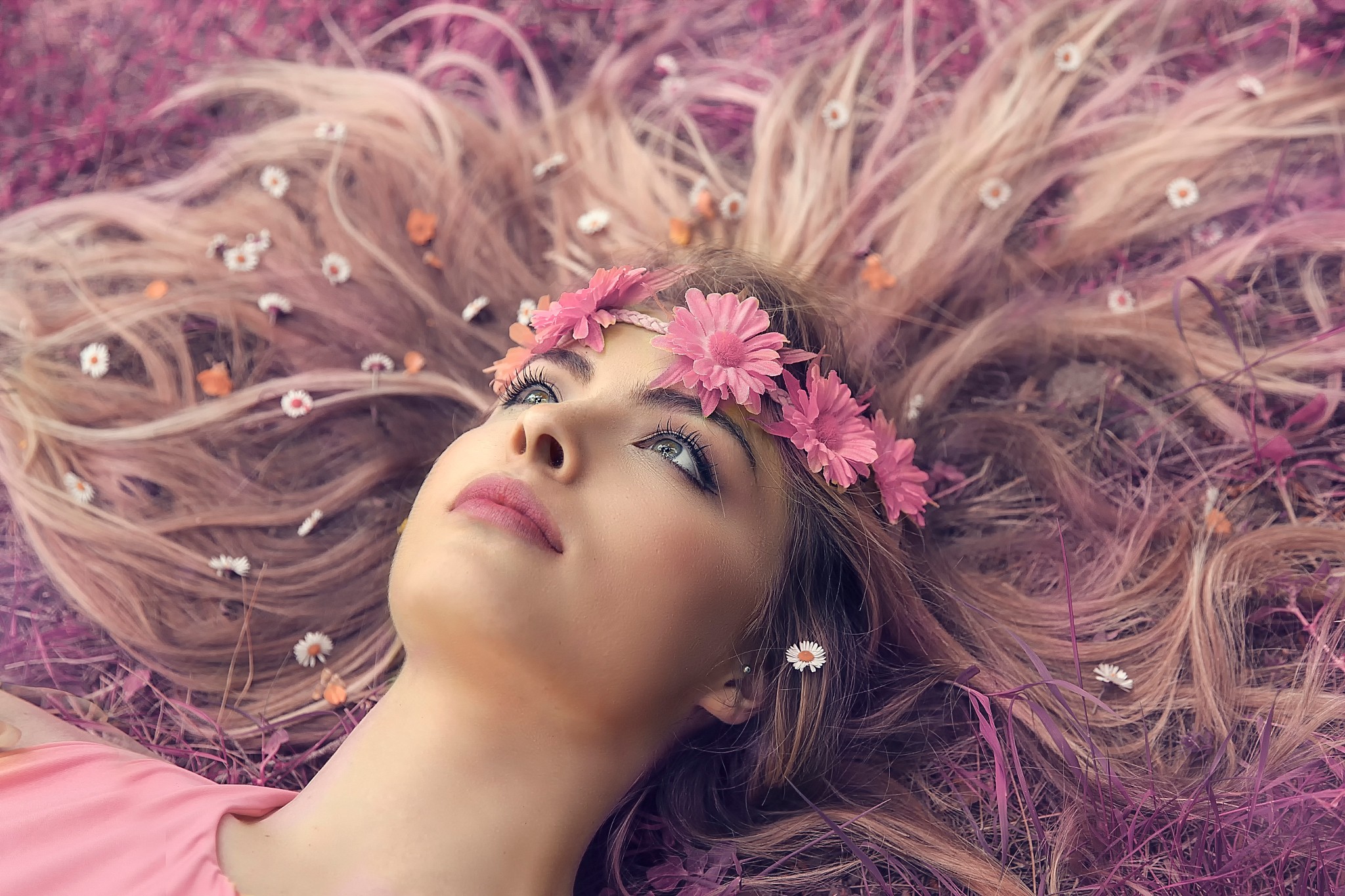 Woman with flower crown lying in grass HD Wallpaper