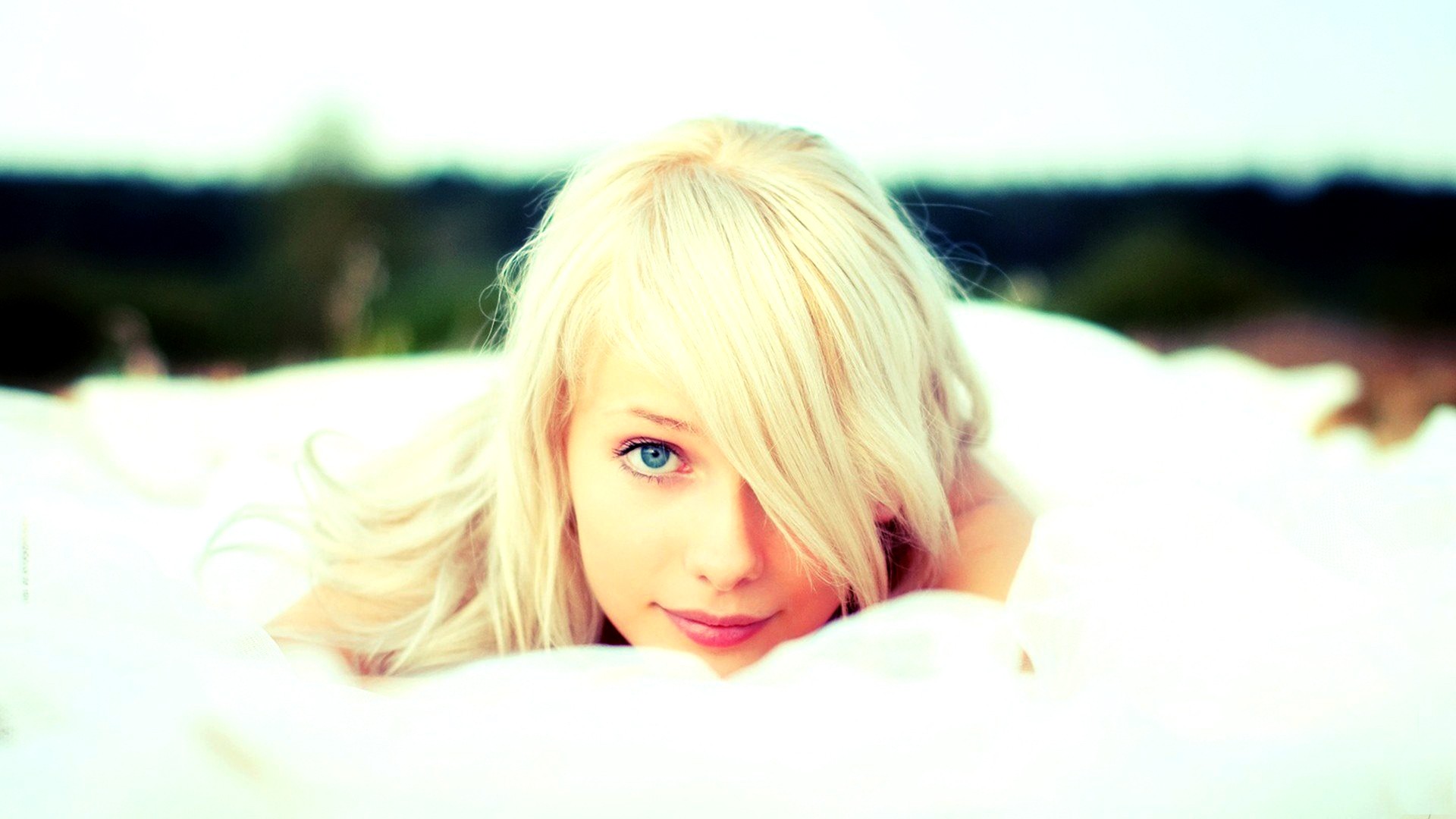 Woman with blonde hair and blue eyes outdoors HD Wallpaper