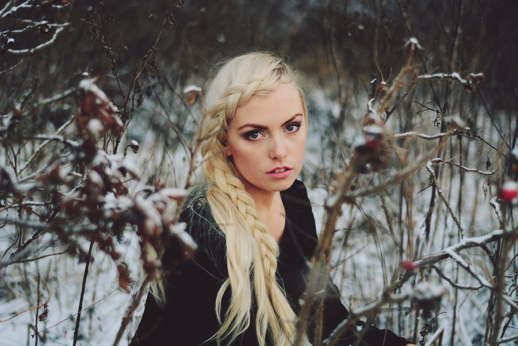 Woman with blonde braid in snowy woods HD Wallpaper