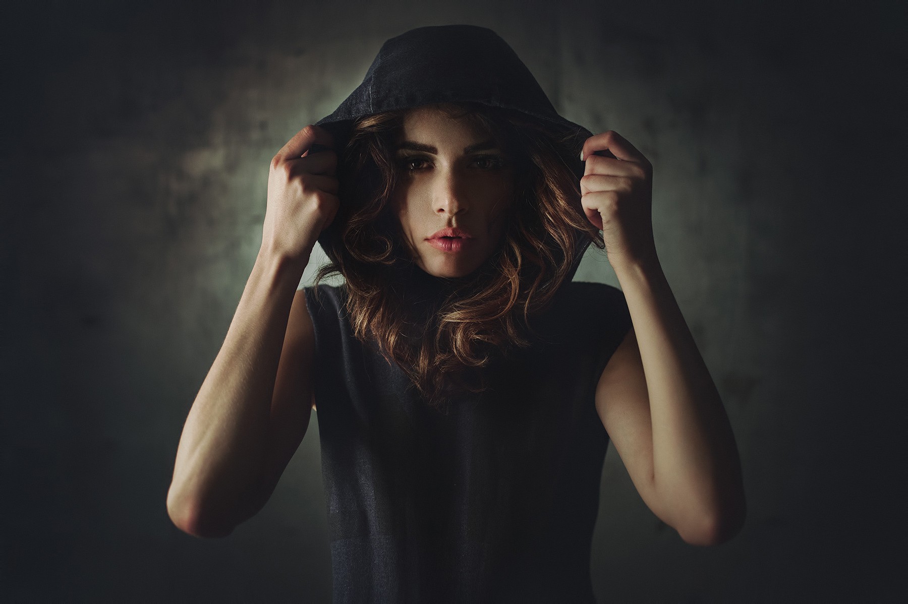 Woman in a dark hoodie HD Wallpaper