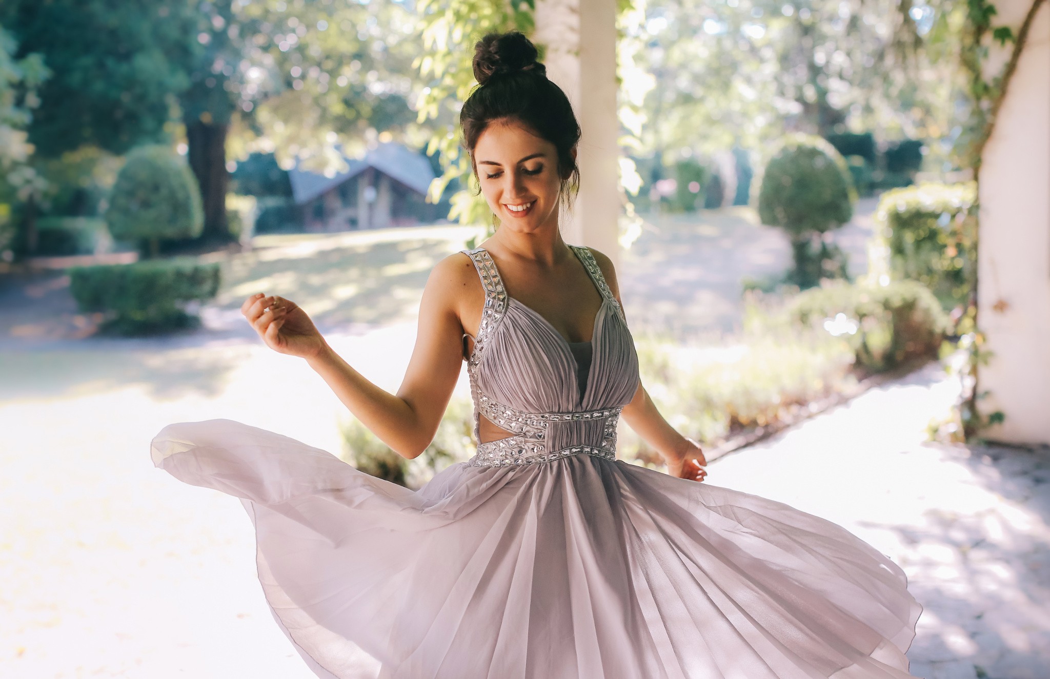 Aurela Skandaj in a flowing white dress outdoors HD Wallpaper