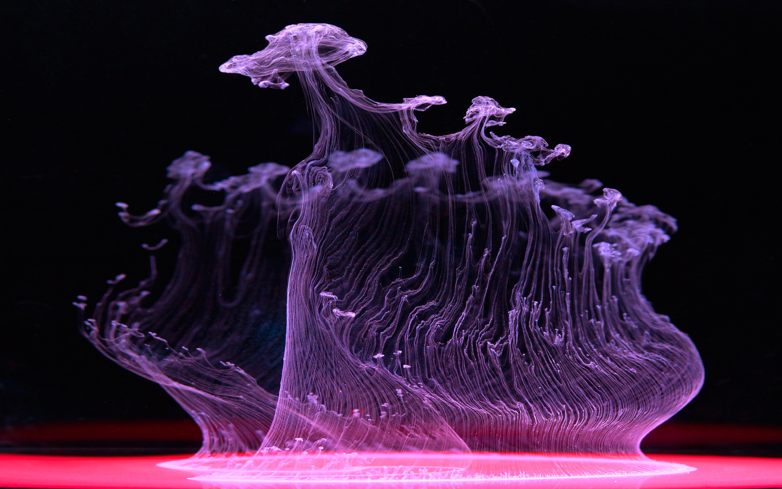 Abstract purple ink swirling in water with red light HD Wallpaper