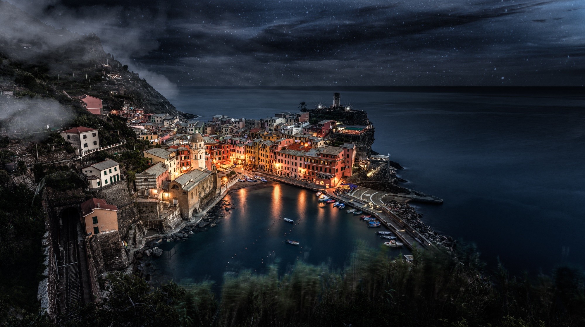Cinque Terre village at night with stars and sea HD Wallpaper