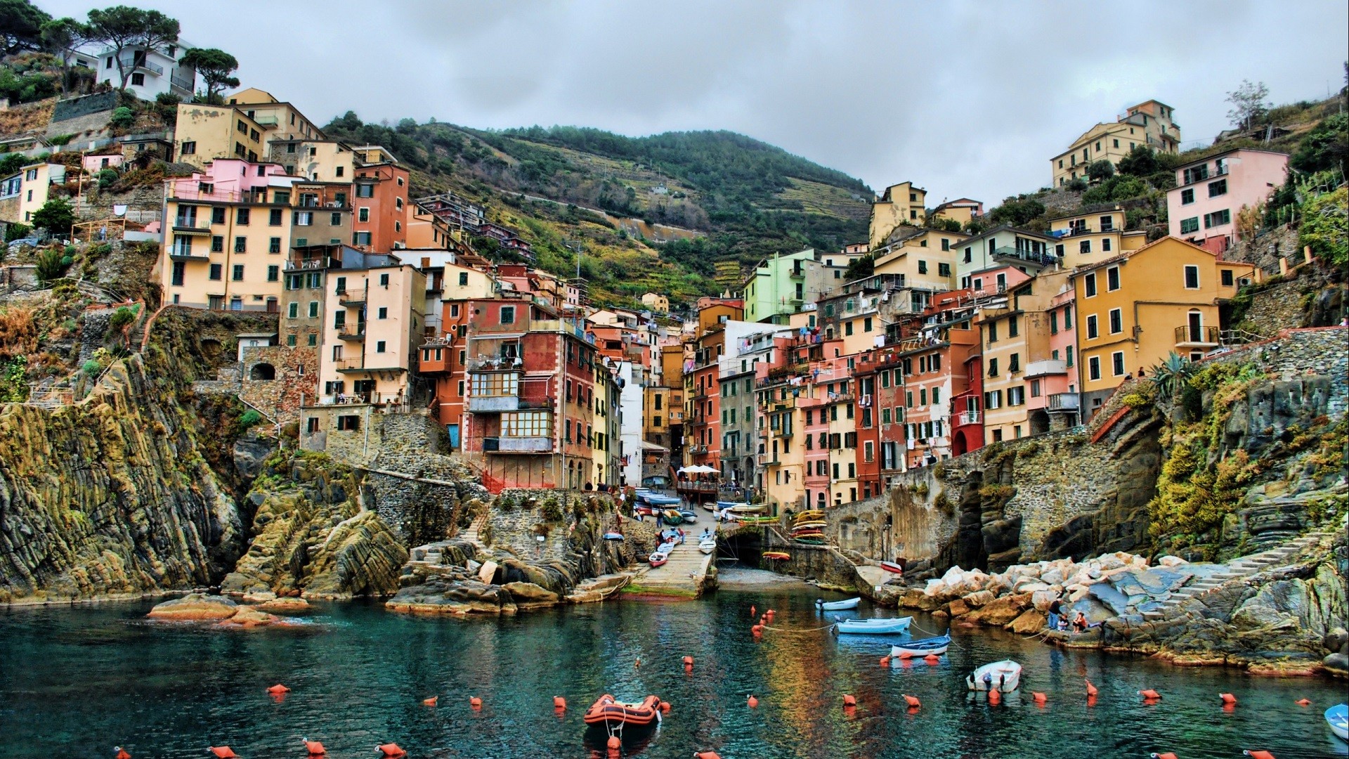 Colorful buildings on a cliffside overlooking the sea in Cinque Terre, Italy HD Wallpaper