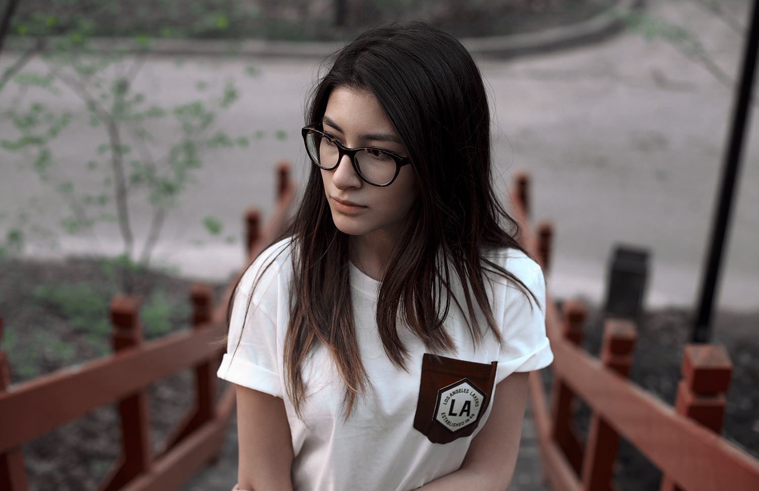 Woman with glasses on wooden stairs HD Wallpaper