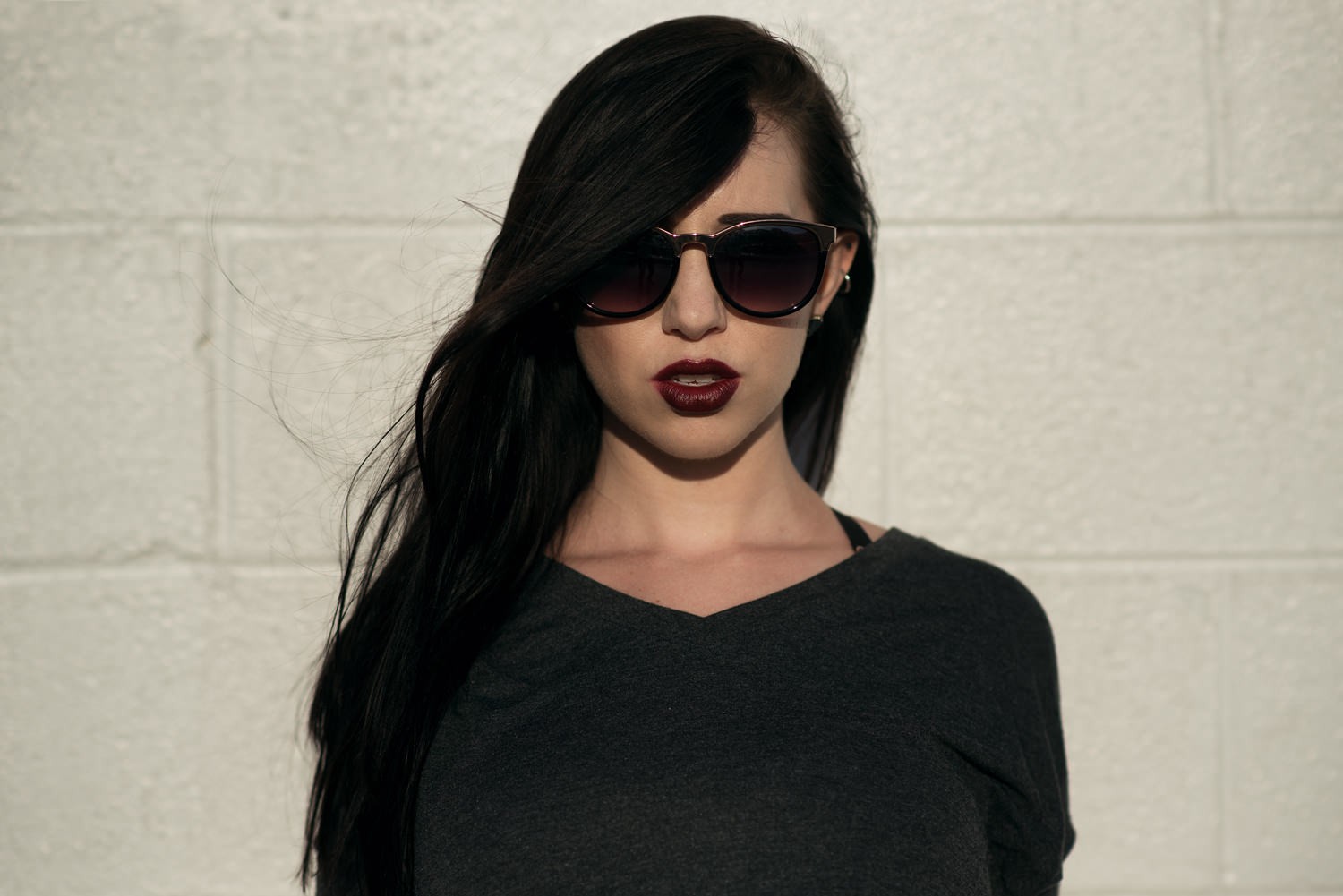 Woman with dark hair and sunglasses HD Wallpaper