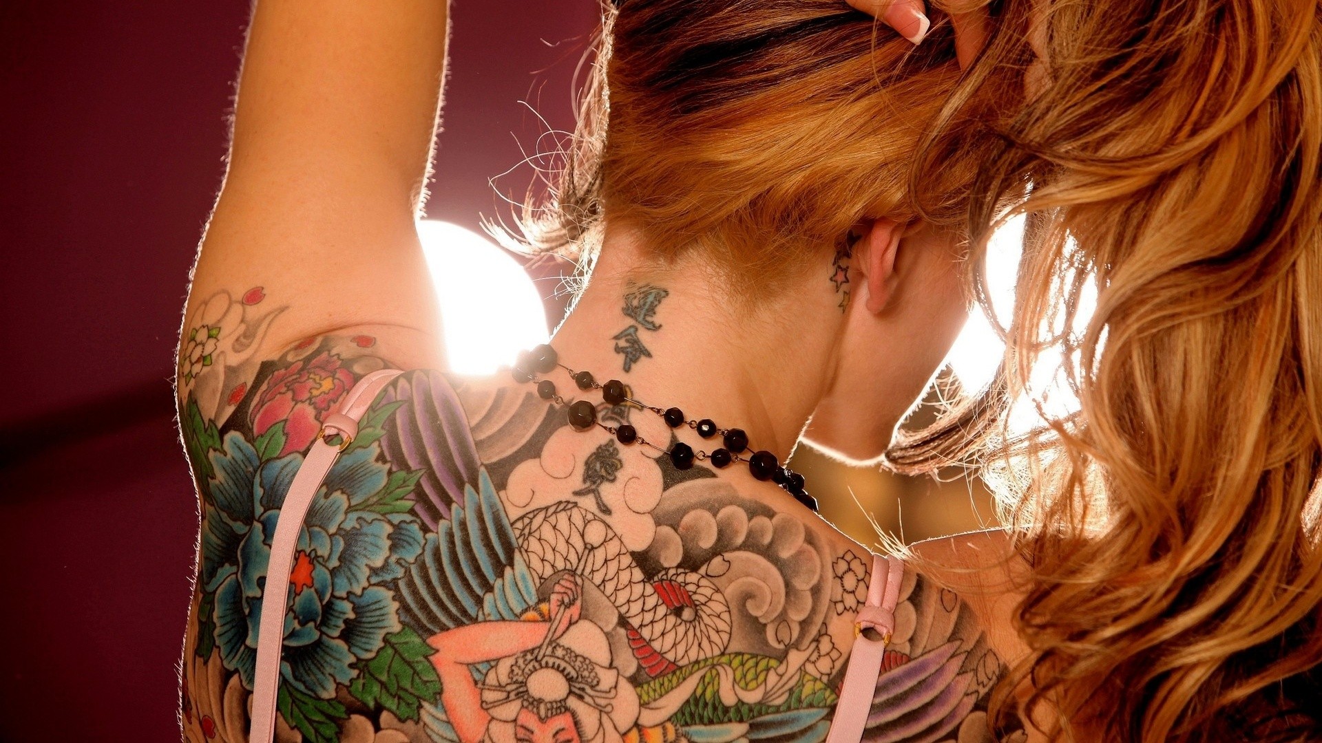 Woman with colorful back and arm tattoos HD Wallpaper