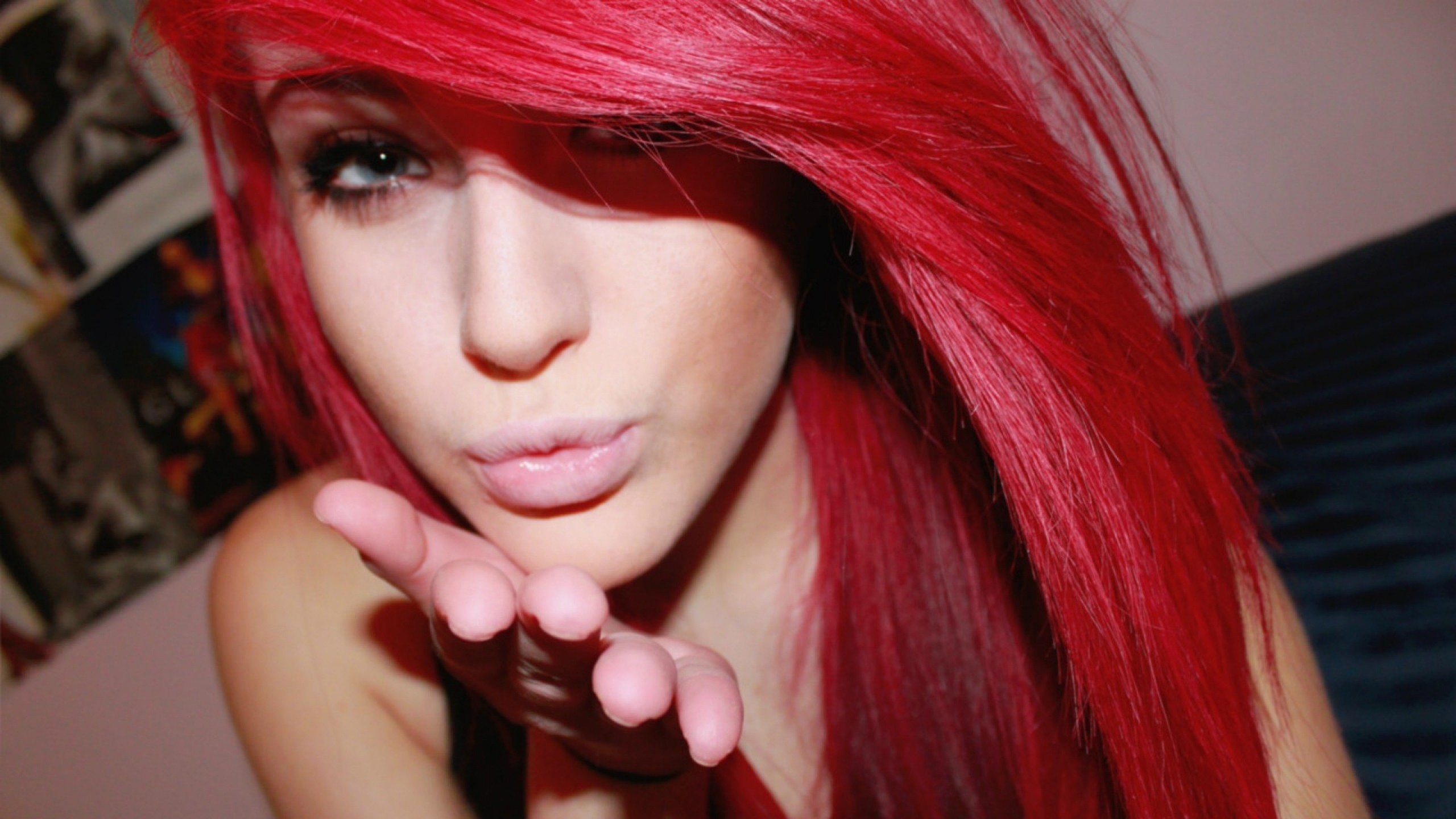 Woman with bright red hair blowing a kiss HD Wallpaper
