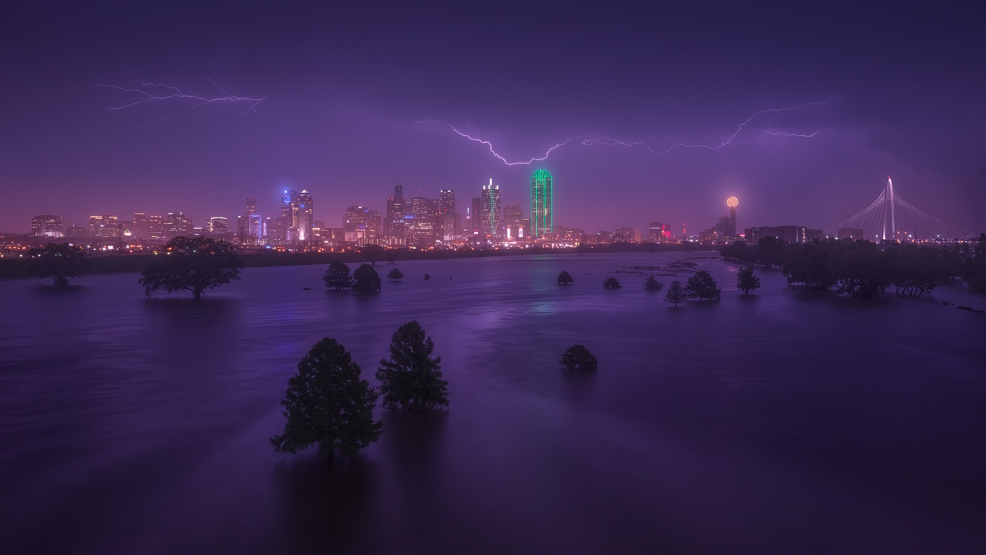 Dallas skyline during a lightning storm over flooded land HD Wallpaper