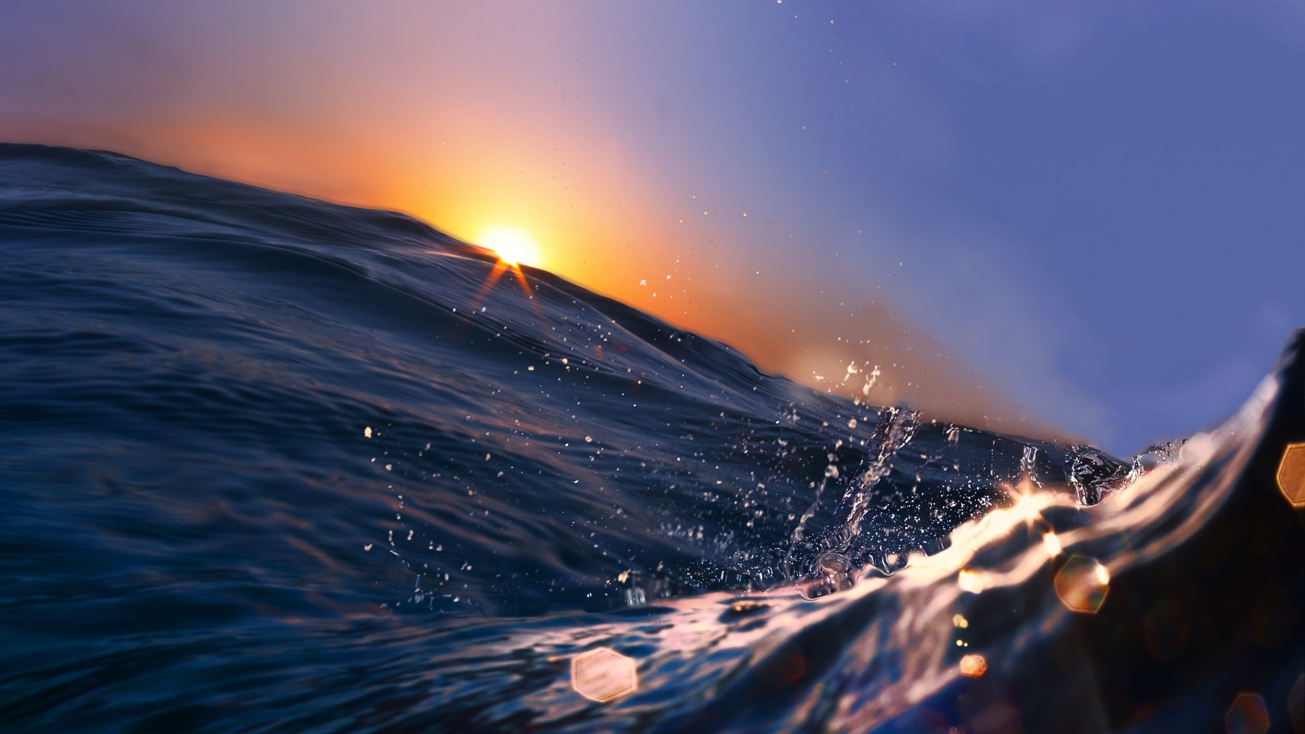 Sunset over ocean waves HD Wallpaper