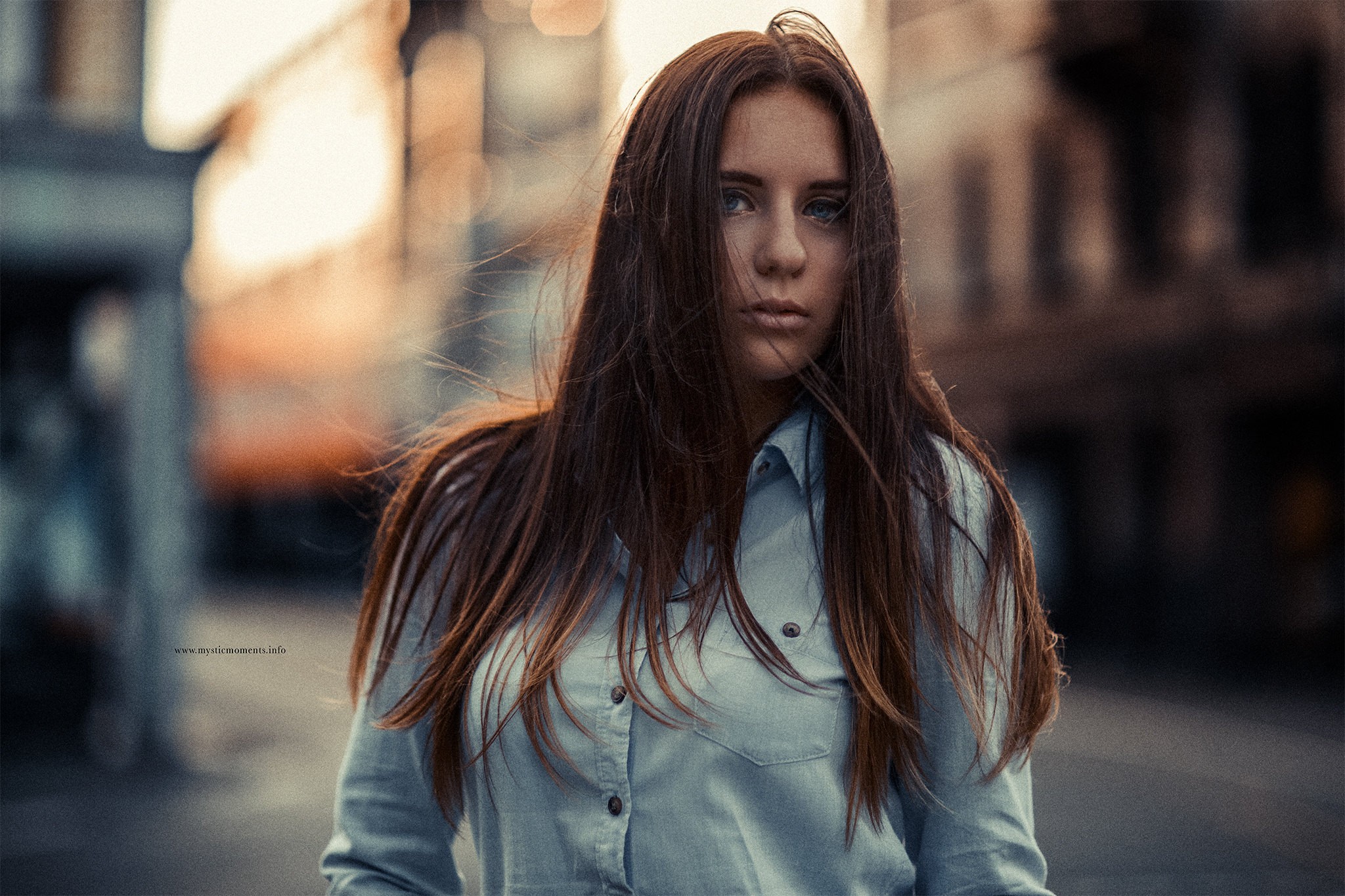 Woman with long brown hair in a blue shirt HD Wallpaper