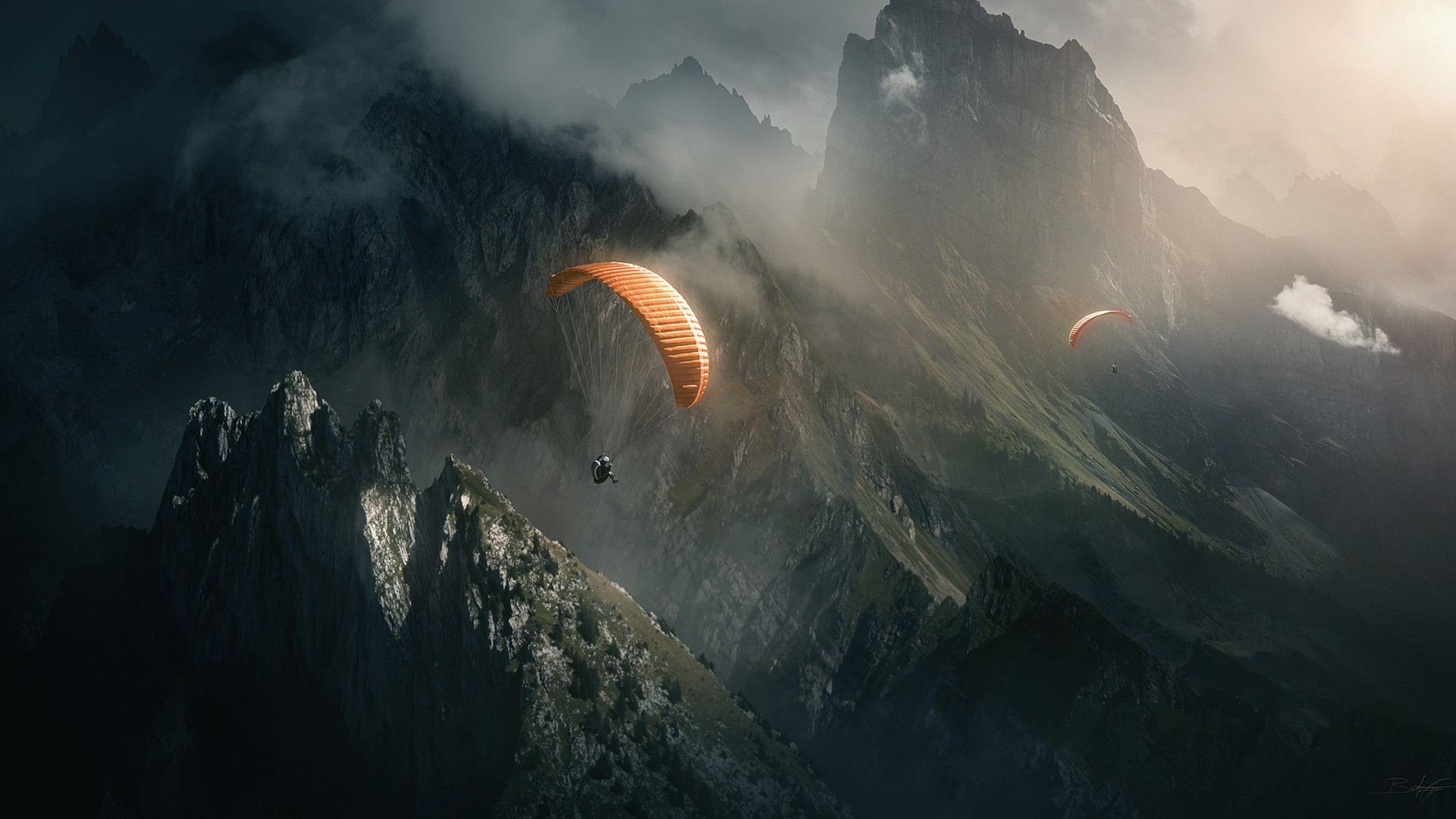 Paragliders soar over misty mountains HD Wallpaper