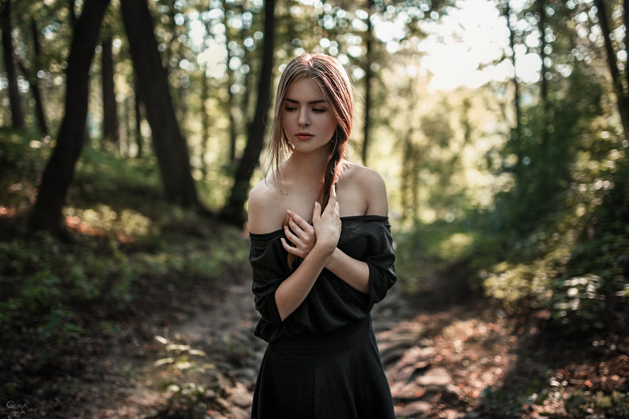 Woman in a black dress in a forest HD Wallpaper