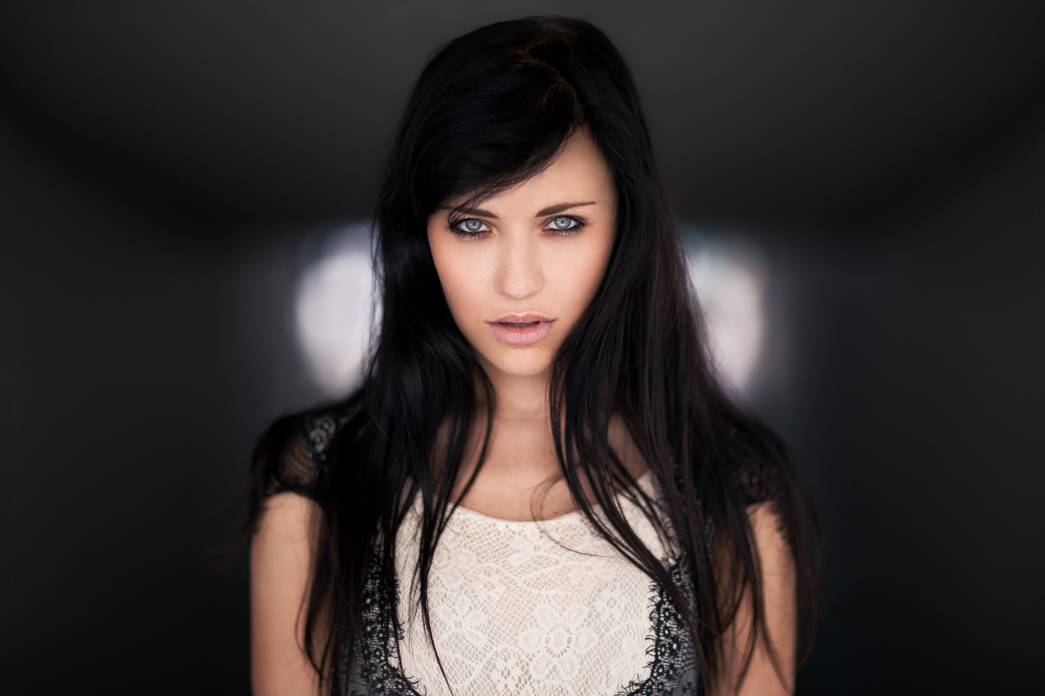 Woman with long dark hair and blue eyes HD Wallpaper