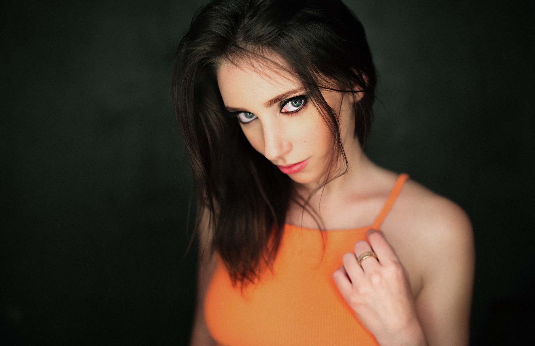 Portrait of a woman with dark hair and blue eyes HD Wallpaper