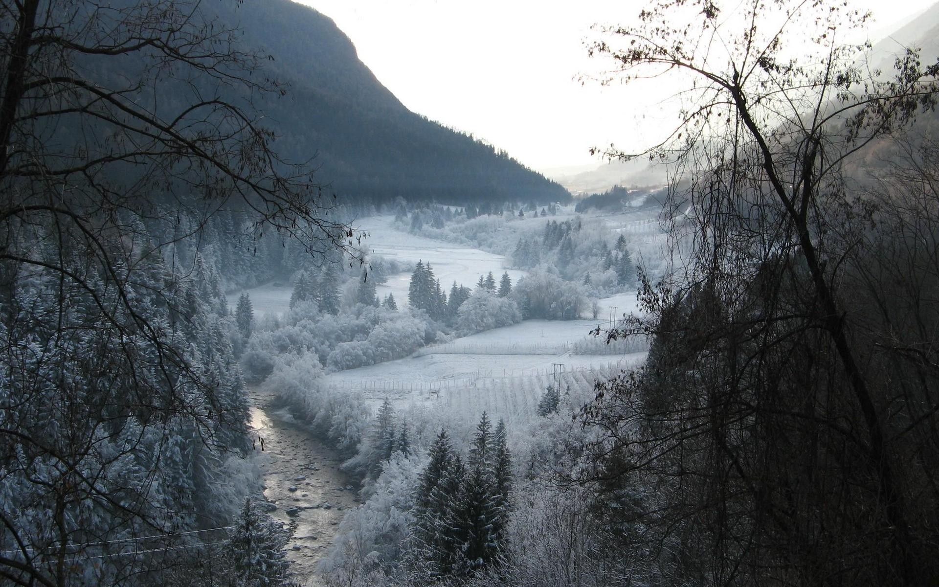 Snowy valley with a river and mountains HD Wallpaper