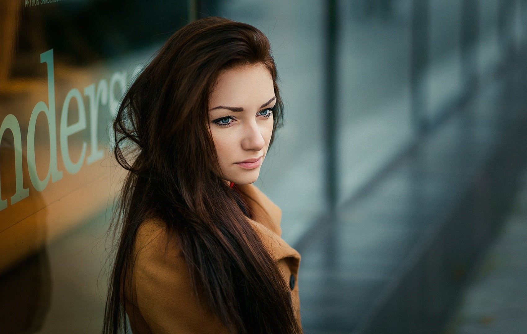 Woman with long brown hair and blue eyes HD Wallpaper