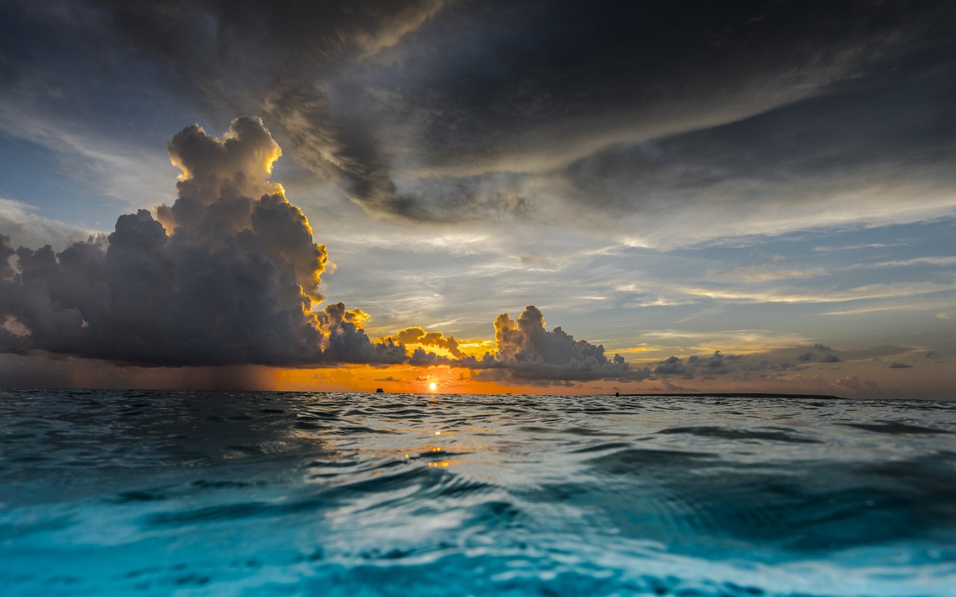 Sunset over the ocean with dramatic clouds HD Wallpaper