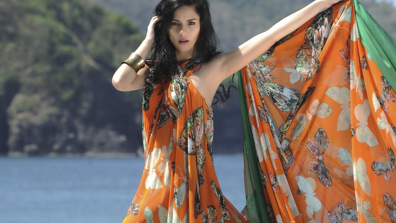 Woman in a butterfly print sarong outdoors HD Wallpaper