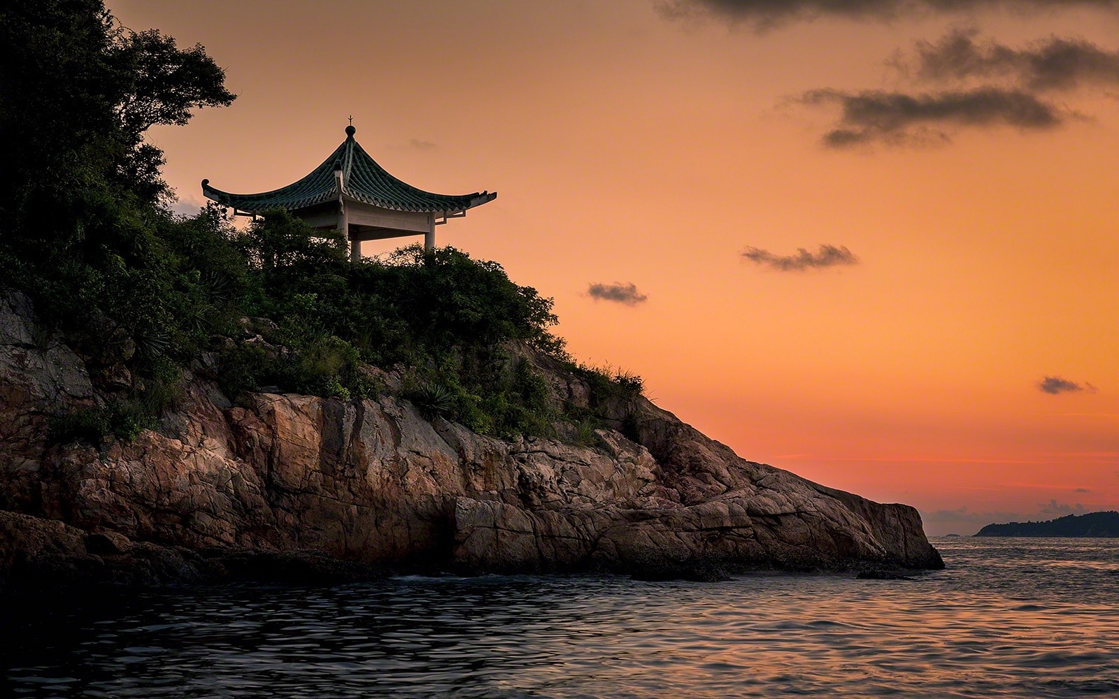 Pagoda on a rocky coast at sunset HD Wallpaper