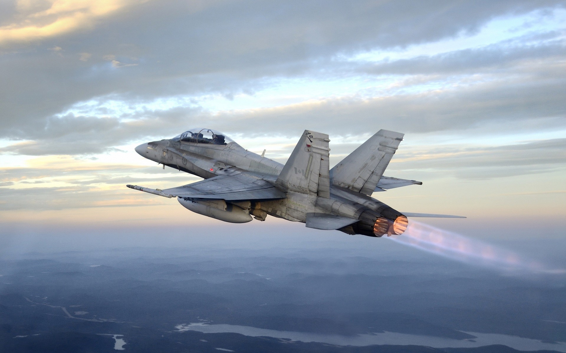 McDonnell Douglas CF-18 Hornet flying over landscape HD Wallpaper