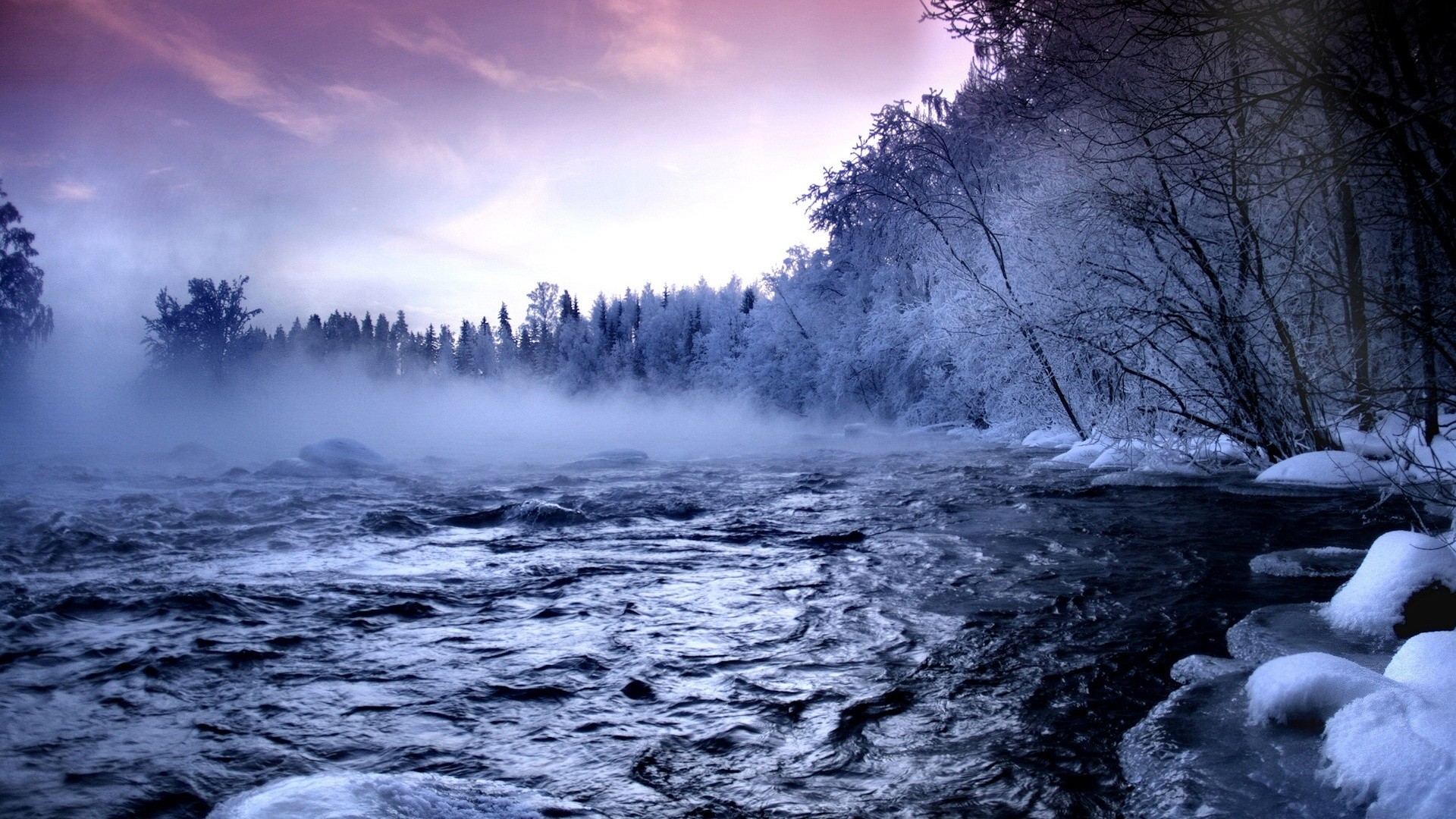 Misty river flowing through a snowy winter forest HD Wallpaper