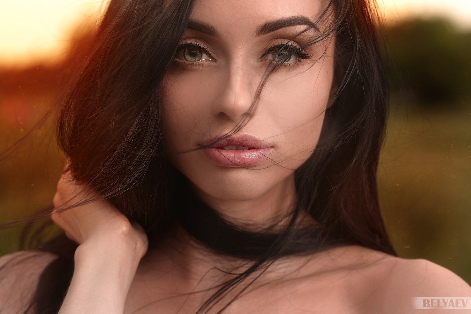 Portrait of a brunette woman with flowing hair HD Wallpaper