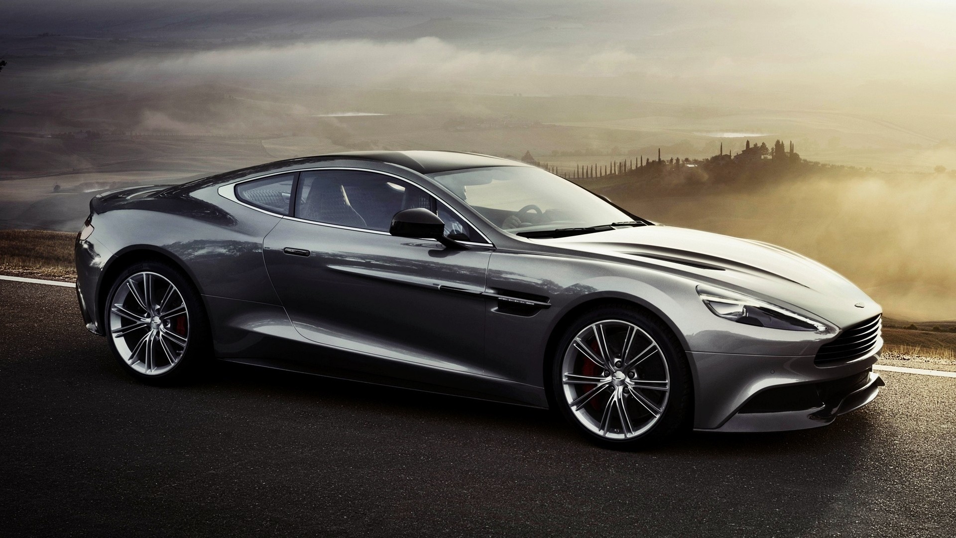 Aston Martin Vanquish in a misty landscape HD Wallpaper