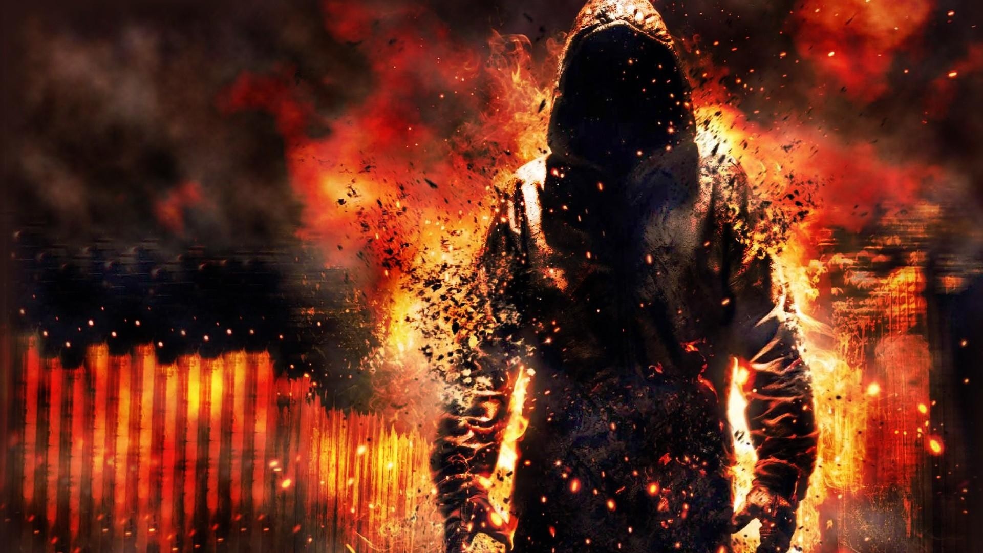 Figure engulfed in flames in a burning city HD Wallpaper