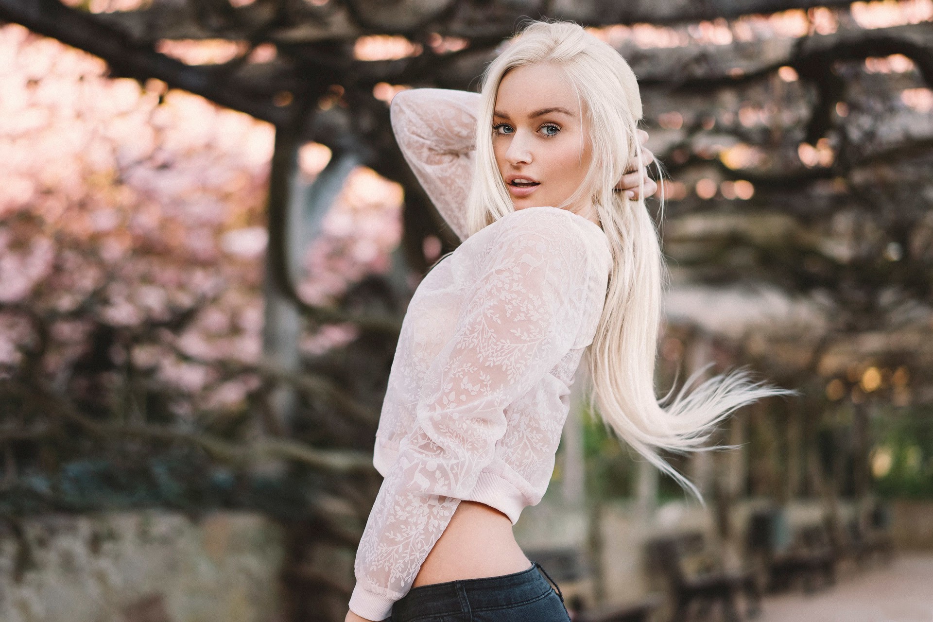 Blonde woman with blue eyes outdoors HD Wallpaper