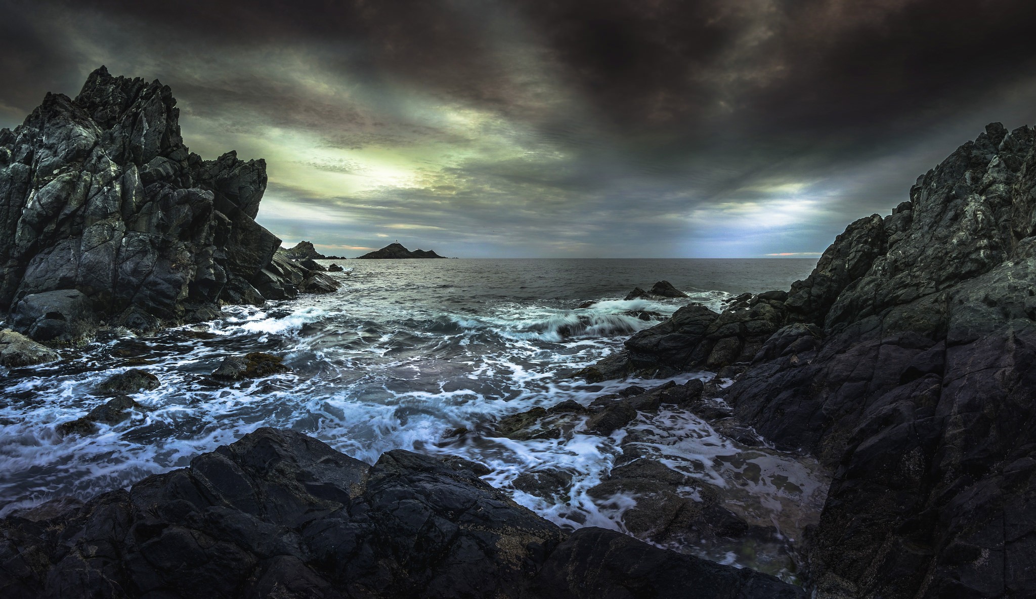 Rocky coast with stormy sea and dramatic sky HD Wallpaper