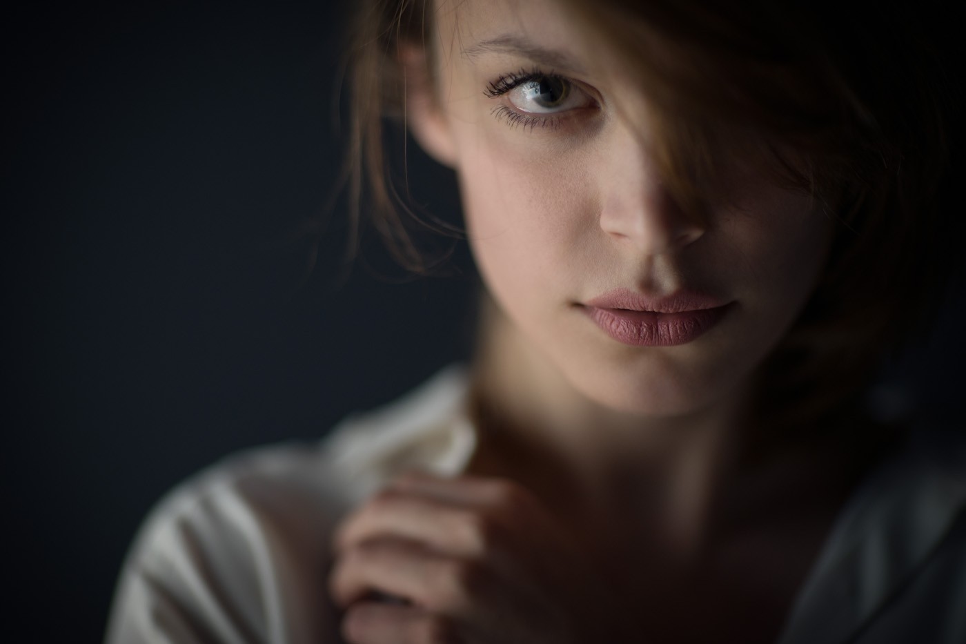 Portrait of a young woman with hair covering her face HD Wallpaper