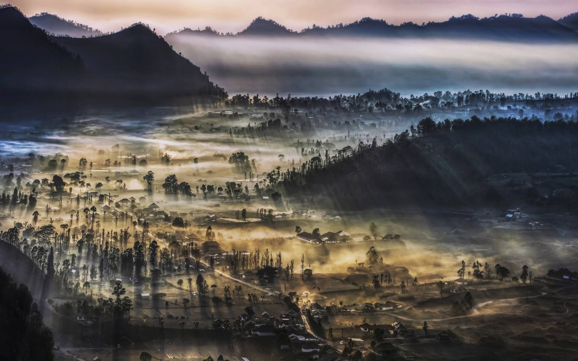 Misty valley with villages and mountains in Indonesia at morning HD Wallpaper