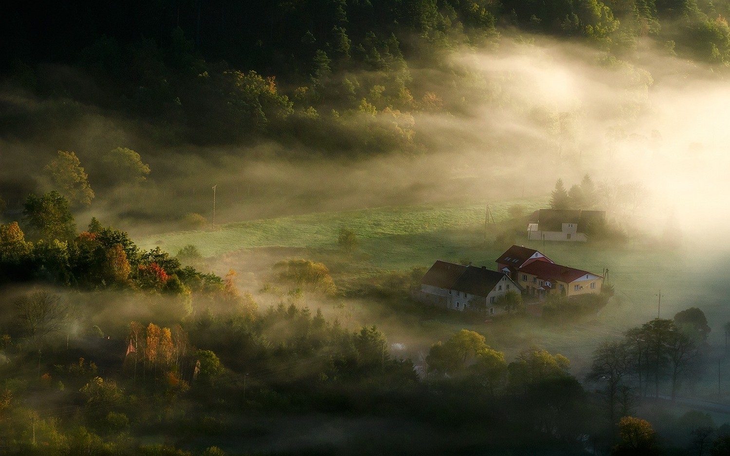 Misty morning over a village in the hills HD Wallpaper