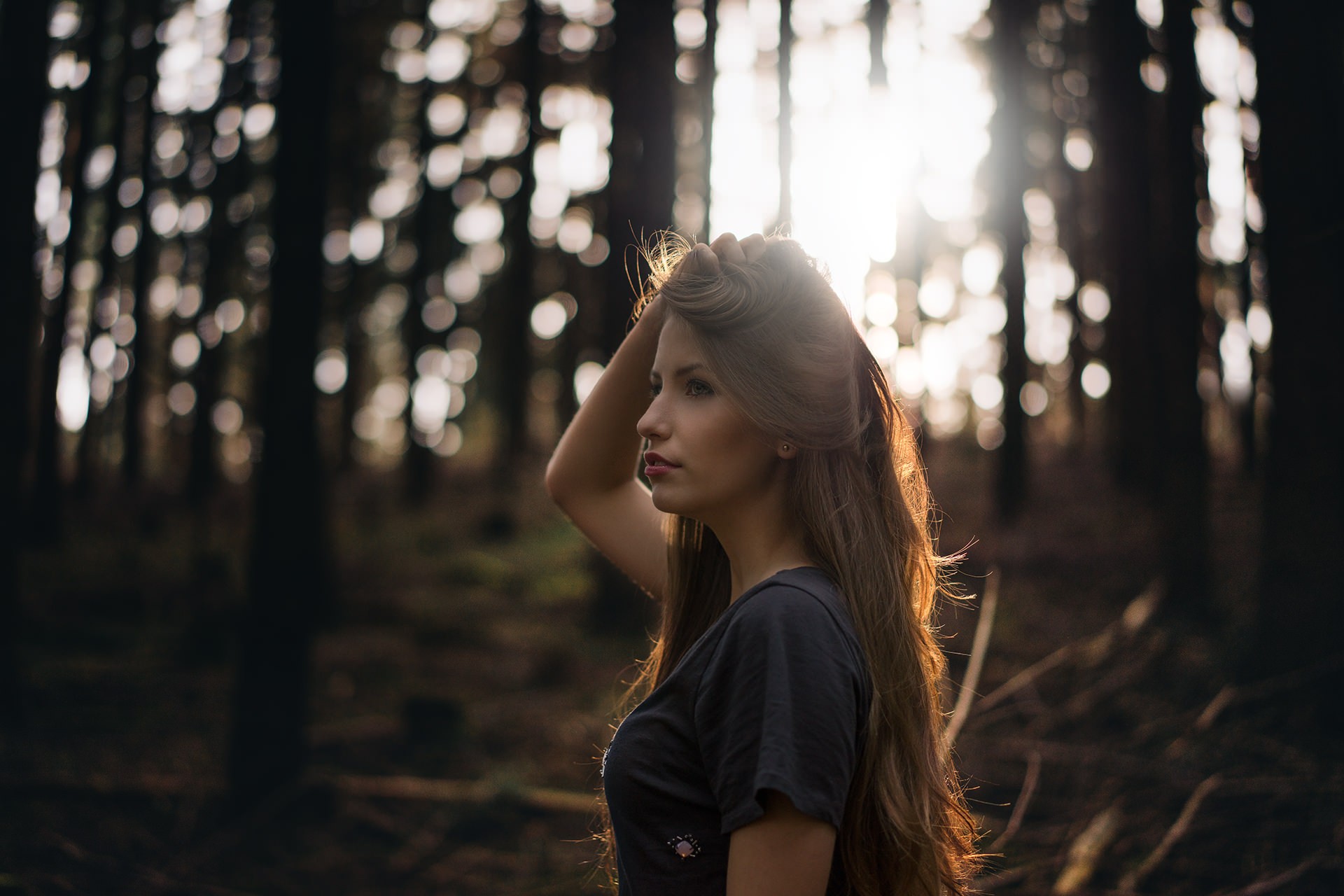 Woman with long hair in a forest HD Wallpaper