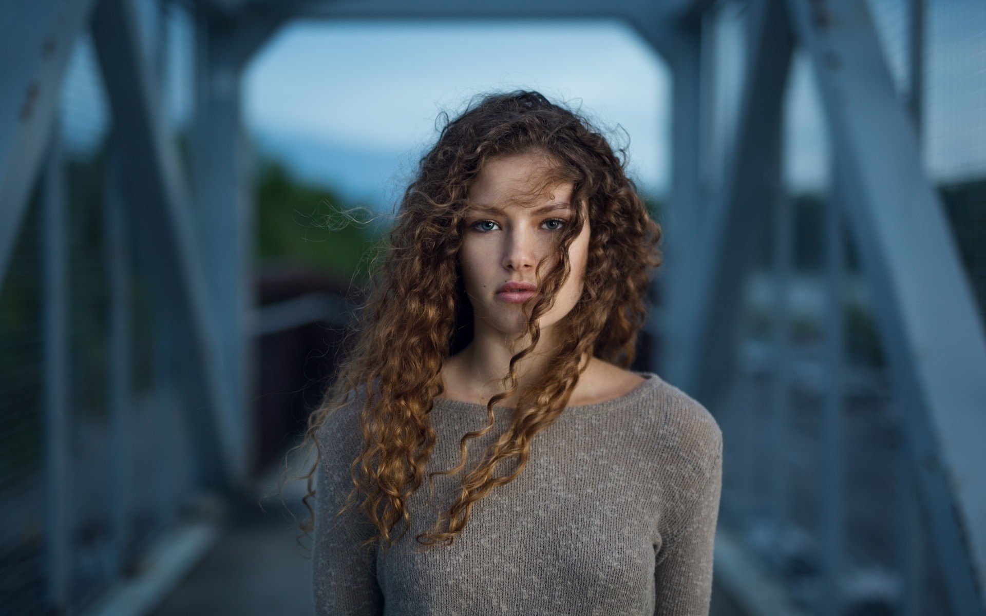 long hair, curly hair, brunette, women outdoors, women, bridge, sweater, model, open mouth, looking at viewer, blue eyes, windy HD Wallpaper