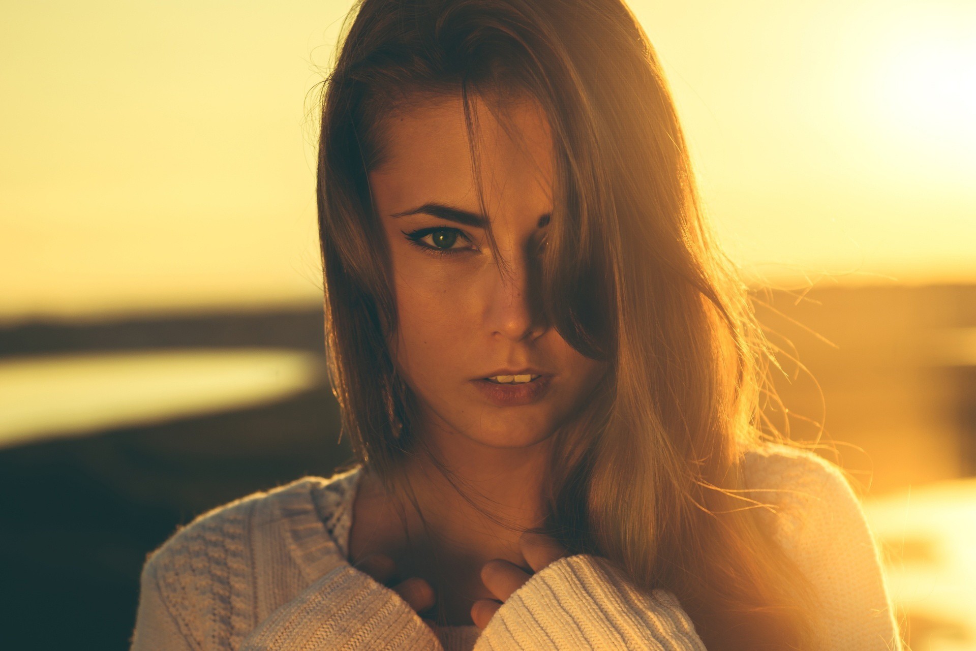 Woman with blonde hair in a white sweater at sunset HD Wallpaper