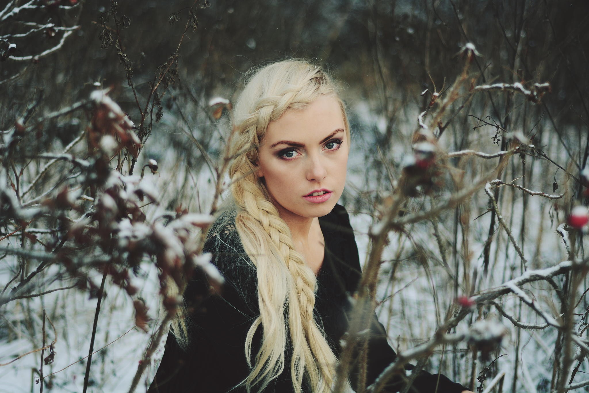 Woman with blonde braid in snowy woods HD Wallpaper