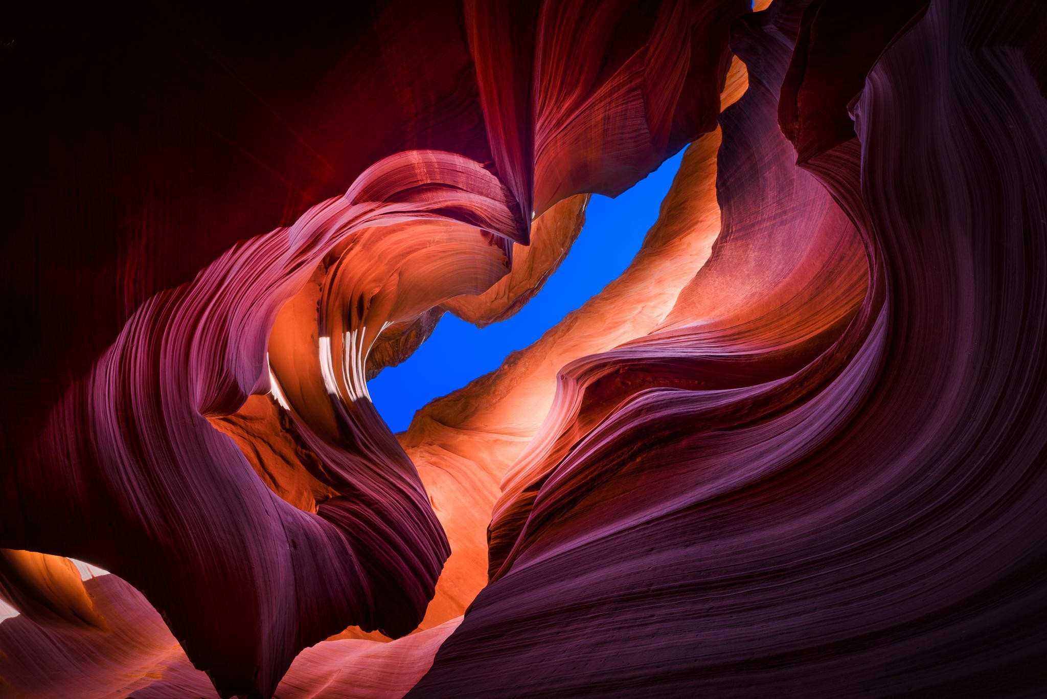 Antelope Canyon rock formations with blue sky above HD Wallpaper