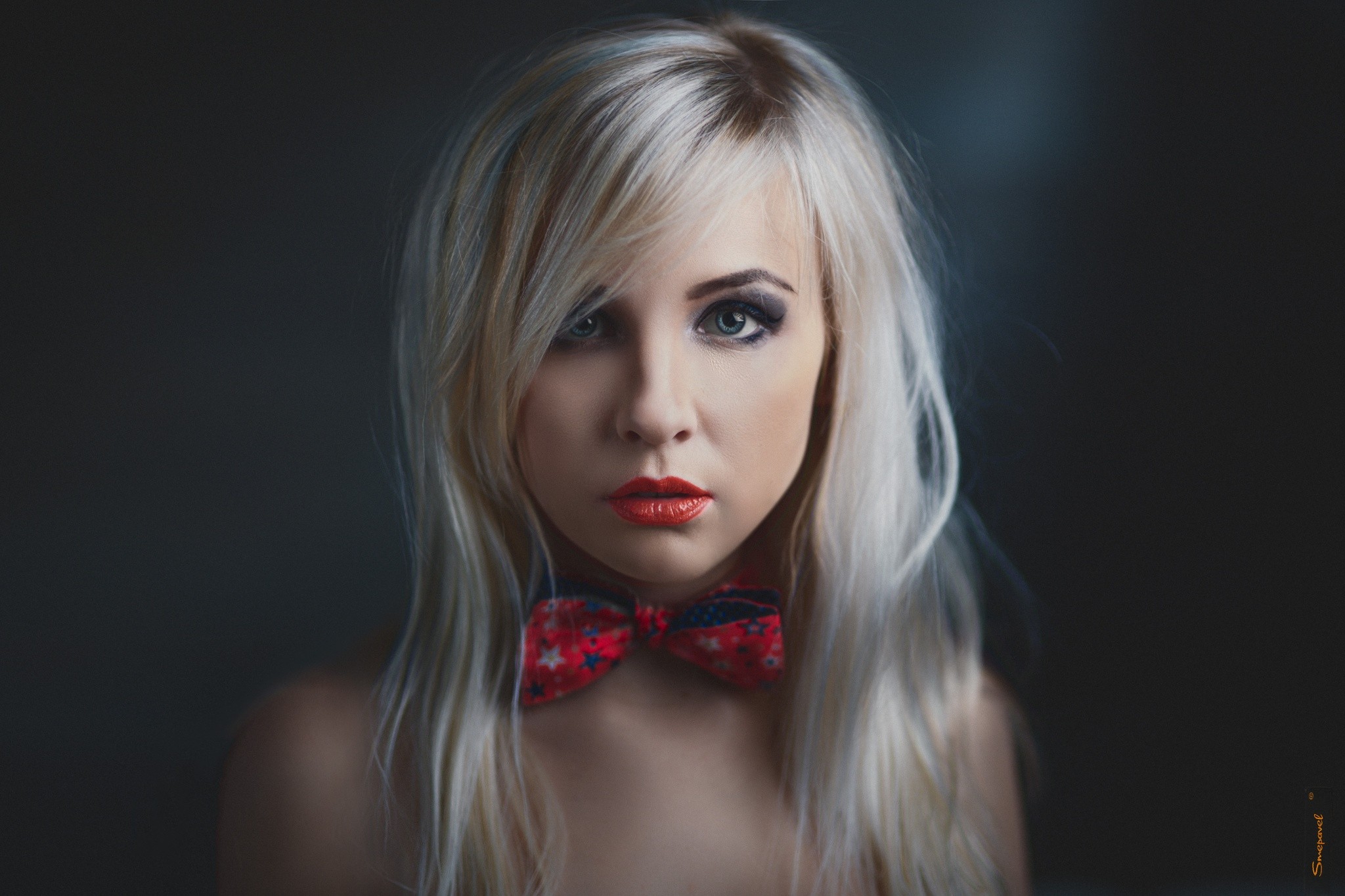 Portrait of a blonde woman with a bow tie HD Wallpaper
