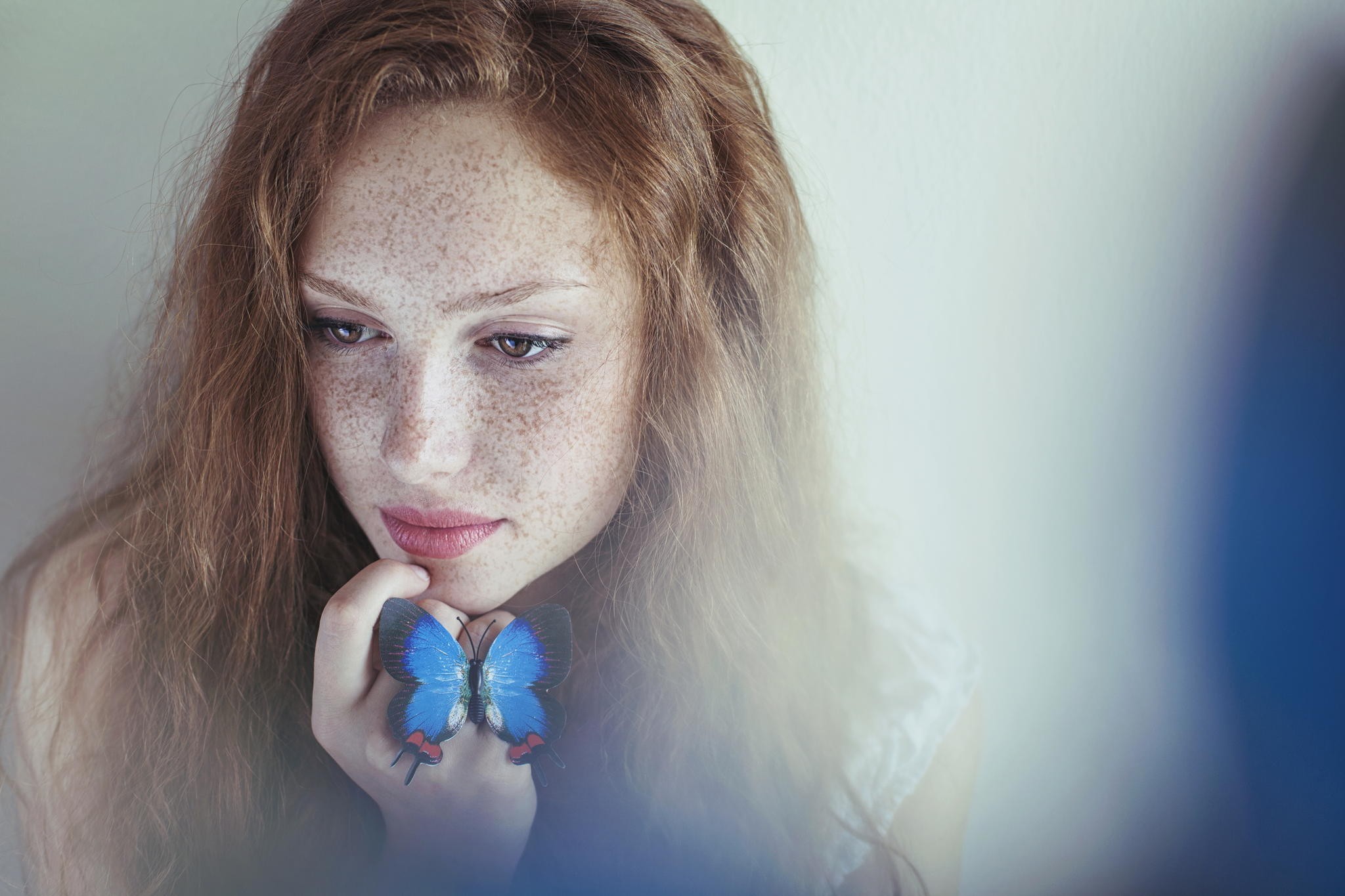 Portrait of a redhead woman with freckles and a butterfly HD Wallpaper