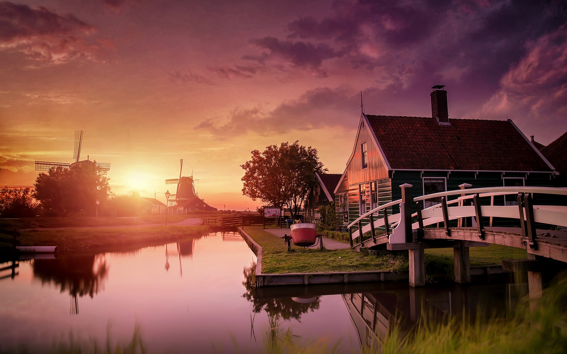 Sunset over Zaanse Schans with windmills and canal HD Wallpaper